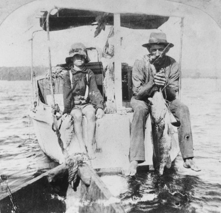 Sandy Straits Fisherman, ca 1920. Australian publid domain image.