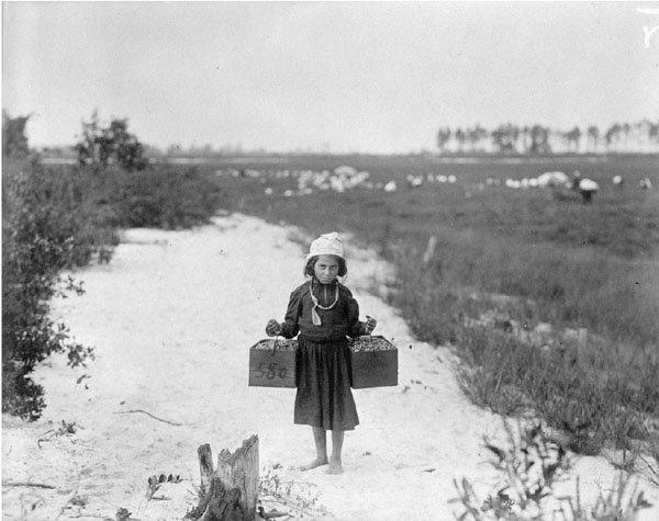 Rose Biodo, Philadelphia, 10 years old. Working 3 summers, minds baby and carries berries, two pecks at a time." Photo by Lewis Hine, public domain.
